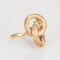 Bague Bague nœud infini vintage années 1970 en or jaune 14k, corail et rubis 58 Facettes G12466