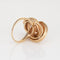 Bague Bague nœud infini vintage années 1970 en or jaune 14k, corail et rubis 58 Facettes G12466