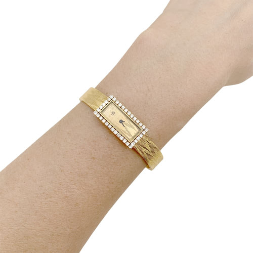 Montre UTI - Montre vintage en or jaune 750/000 et diamants 58 Facettes 34991