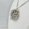 Pendentif Broche/Pendentif - Motif fleur en or blanc et diamants 2,4 ct 58 Facettes 1840