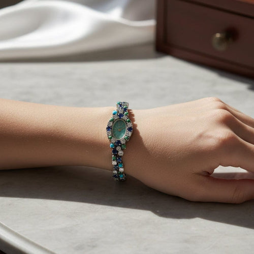 Montre Uti - Montre Ovale - Or Blanc - Diamants, Saphirs et Turquoise 58 Facettes 1.0001001/1