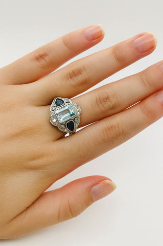 Bague 54 Bague Art Déco en platine ornée d'aigues-marines, de saphirs et de diamants 58 Facettes 50308