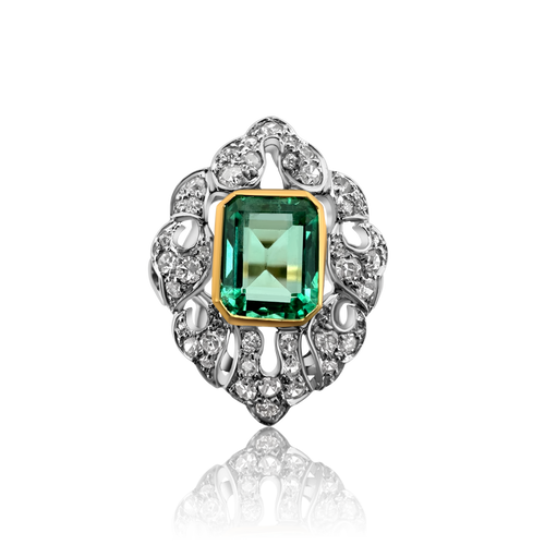 Bague Art Déco en or jaune et blanc sertie d'une émeraude.