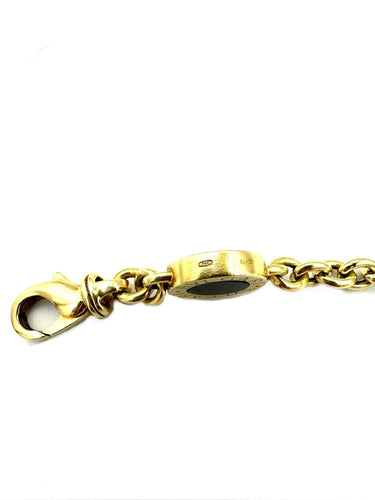 Bracelet BVLGARI. Collection "BVLGARI-BVLGARI", bracelet or jaune et onyx 58 Facettes