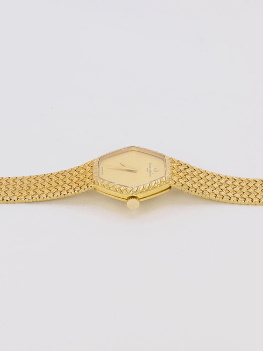 BAUME & MERCIER - Montre vintage or jaune maille tressée