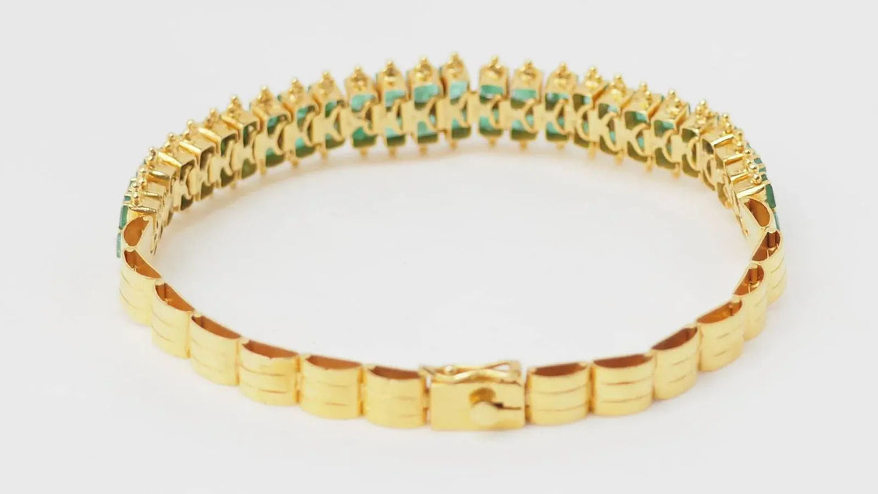 Bracelet souple en or jaune et émeraudes