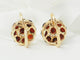 Boucles d'oreilles Boucles d'oreilles dormeuses en or jaune et grenat 58 Facettes 33473