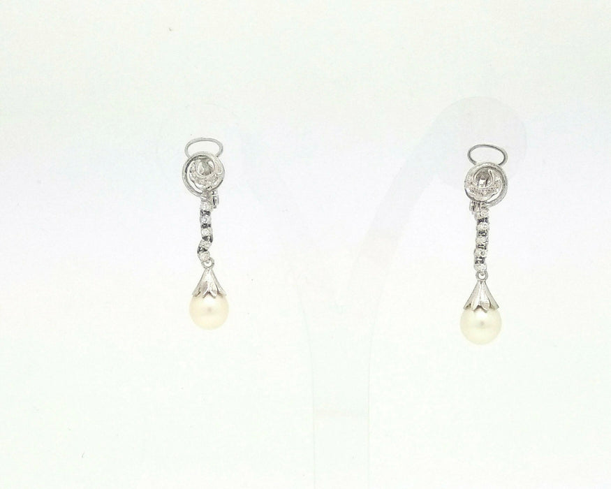 Boucles d'oreilles en or blanc avec perles et diamants