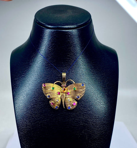 Pendentif papillon en or jaune et pierres précieuses