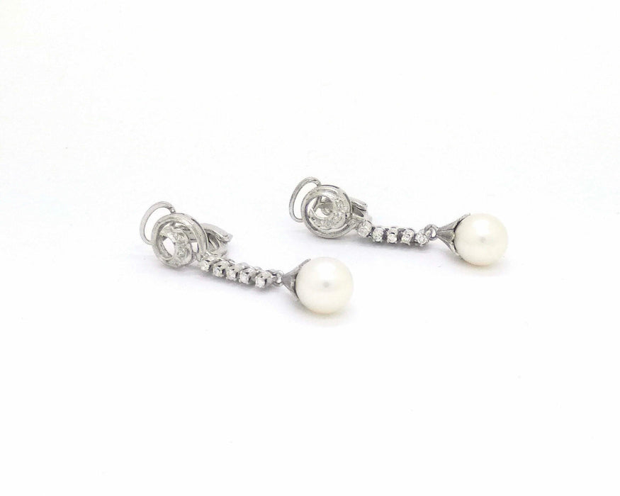 Boucles d'oreilles en or blanc avec perles et diamants