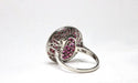 Bague 57 Art deco style ring in platinum with diamonds and cabochon rubies. 58 Facettes