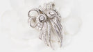 Broche Broche Art déco double clips en or blanc et platine, diamants 58 Facettes 32946