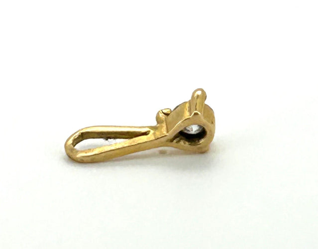 Pendentif Pendentif or 18kt avec un diamant de 0.50cts poids total 0.38 grammes 58 Facettes 461