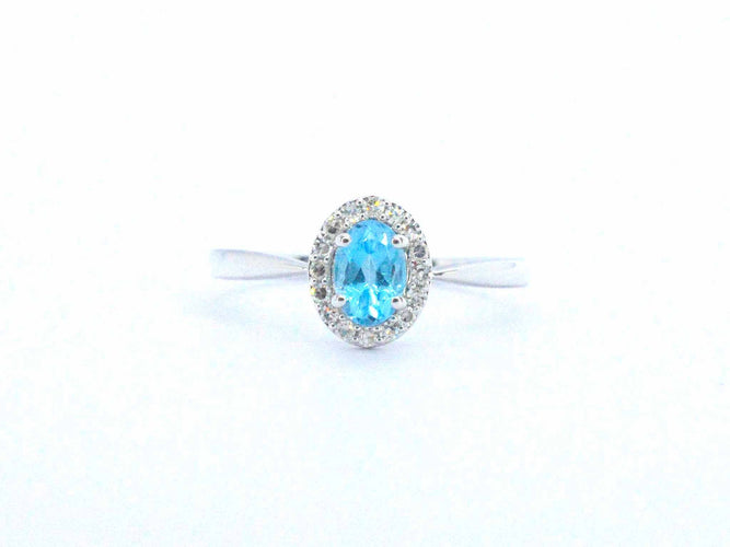 White gold ring with a blue topaz and natural diamonds 58 Facettes 2367