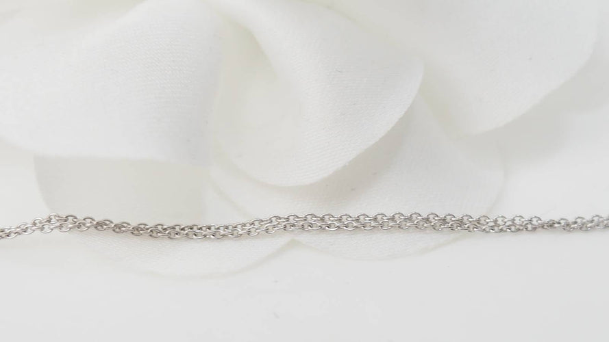 Collier Collier solitaire en or blanc et topaze bleue 58 Facettes CLAL