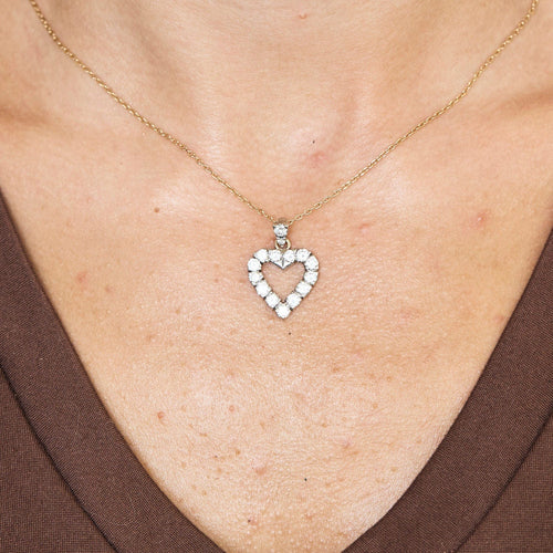 Pendentif Pendant coeur en or blanc et diamants 58 Facettes 250379