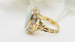 Bague 48 Bague ancienne en or jaune et cabochon d'opale 58 Facettes 32676