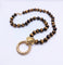Collier Collier 70s' en or et oeil-de-tigre 58 Facettes