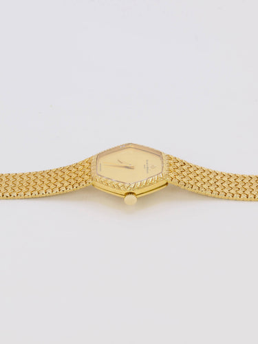 Montre BAUME & MERCIER Montre vintage or jaune maille tressée 58 Facettes 1067.3