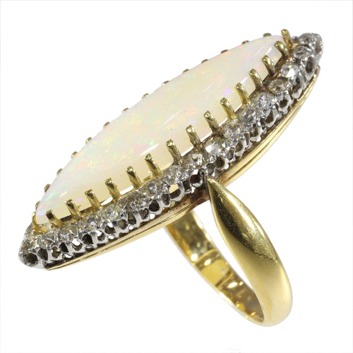 Bague 55 L'élégance victorienne : le chef-d'œuvre de la bague en opale et diamant de 1880 58 Facettes 16054-0031