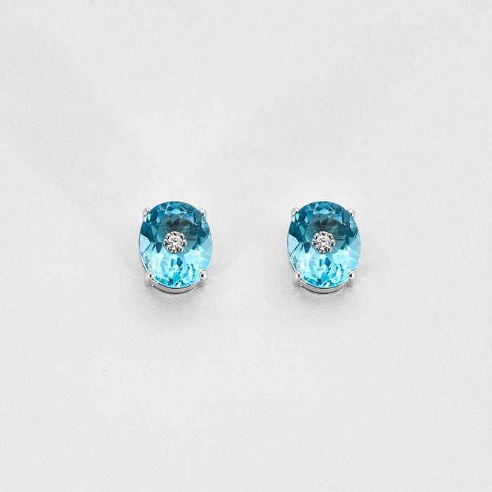 Boucles d'oreilles Paire de boutons d'oreilles en or blanc ornées de 2 topazes et 2 diamants 58 Facettes