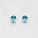 Boucles d'oreilles Paire de boutons d'oreilles en or blanc ornées de 2 topazes et 2 diamants 58 Facettes