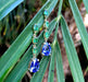 Boucles d'oreilles Boucles d'oreilles pendantes en or tanzanite et grenat tsavorite 58 Facettes