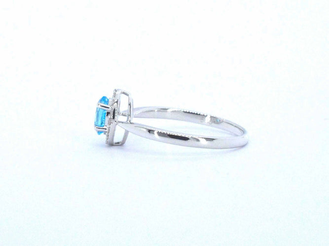 White gold ring with a blue topaz and natural diamonds 58 Facettes 2367