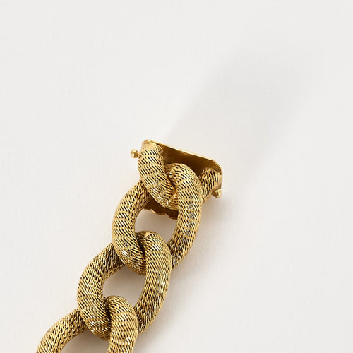 Bracelet en or jaune à maille gourmette tissée