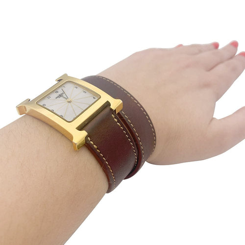 Montre Hermès,"Heure H", plaqué or, acier sur cuir. 58 Facettes 33734