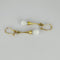 Boucles d'oreilles pendantes en or jaune avec quartz blanc