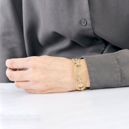 Bracelet Bracelet or jaune et blanc, maille tréssée 58 Facettes SEN2059