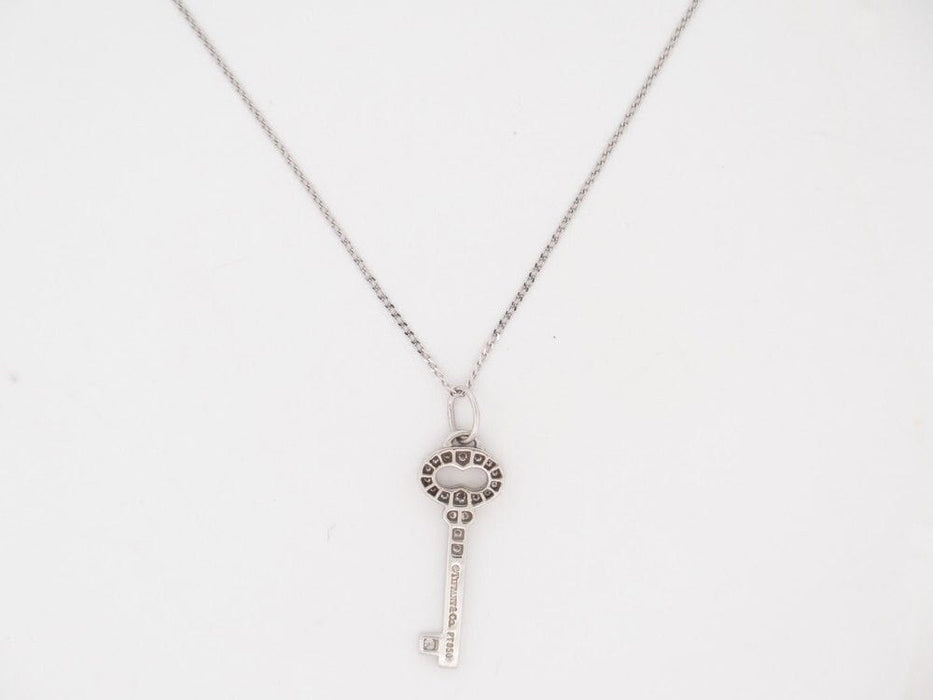 Collier collier TIFFANY & CO cle vintage ovale pendentif platine diamant 58 Facettes 258946