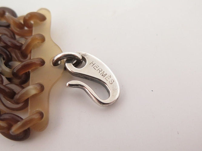 Bracelet bracelet HERMES manchette maillons argent et corne de buffle 58 Facettes 260371
