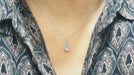 Bague Collier solitaire or blanc et topaze bleue 58 Facettes CLAL