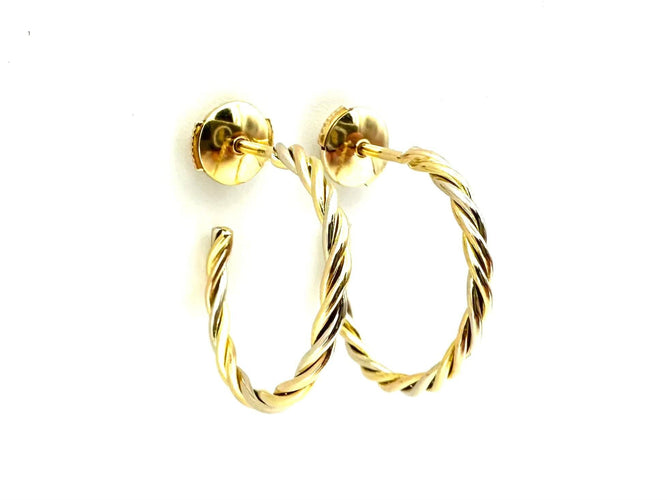 CARTIER. Collection "Trinity", créoles 3 ors torsadées