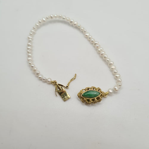 Bracelet Bracelet or jaune 14 carats serti de perles et pierre verte 58 Facettes