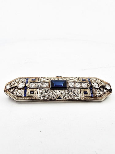 Broche Broche en or blanc, saphirs et diamants 58 Facettes