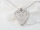 Collier Collier coeur en or blanc et diamants 58 Facettes 33084