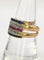 Bague 55.5 Bague Bandeau or jaune sertie de saphirs, émeraudes, rubis et diamants 58 Facettes