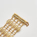 Bracelet Cuff bracelet with openwork decoration in yellow gold 58 Facettes