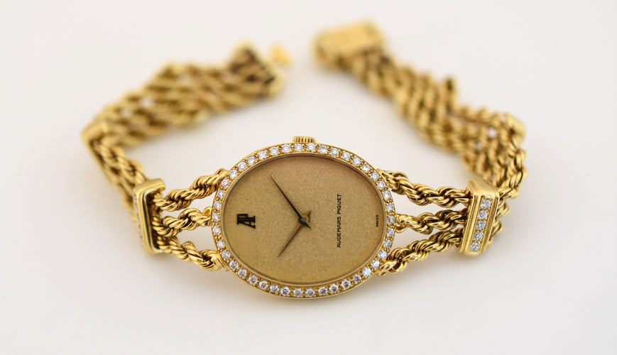 Montre Audemars Piguet - Montre joaillerie femme or jaune & diamants, 1981 58 Facettes AP-100