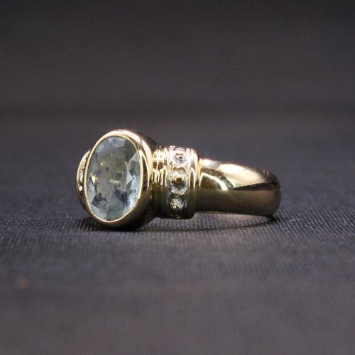 Bague Bague Aigue-Marine ovale sertie clos sur or jaune 58 Facettes