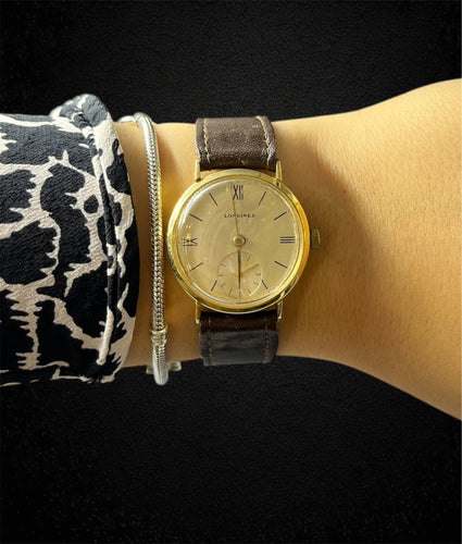 Montre Montre-bracelet Longines Vintage en or jaune 18 carats 58 Facettes