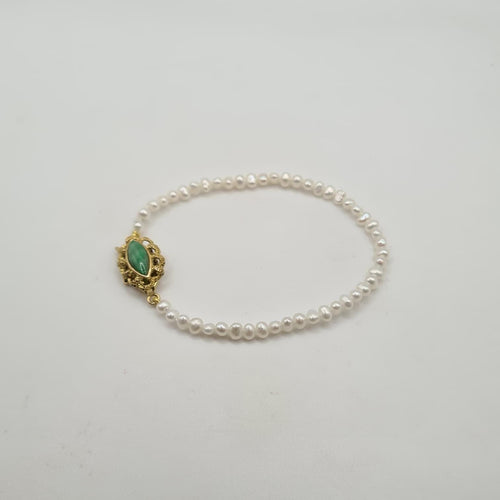 Bracelet Bracelet or jaune 14 carats serti de perles et pierre verte 58 Facettes