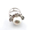 Bague 52 Bague en or blanc avec perle et diamants 58 Facettes