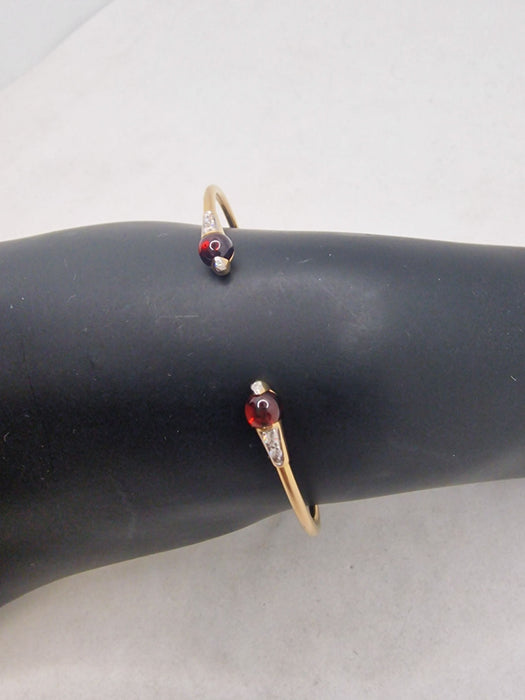 Pomellato Bangle Collection M'Ama non M'Ama 18kt Yellow Gold and Garnets 58 Facettes