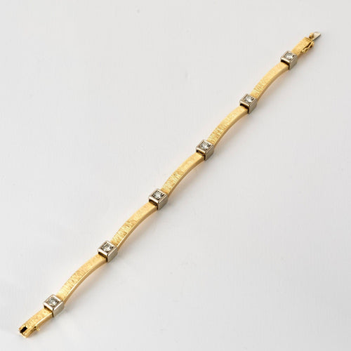 Bracelet Bracelet moderniste en or jaune et gris, et diamants 58 Facettes MEA43045