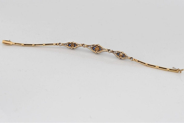 Bracelet Bracelet Art Déco avec diamants, perles et saphirs synthétiques en or jaune et platine 58 Facettes 9530