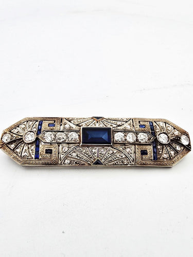 Broche Broche en or blanc, saphirs et diamants 58 Facettes